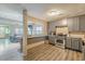 Kitchen features stainless steel appliances and an open layout to the living area at 217 Maple Nw St, Atlanta, GA 30314