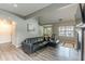 Living area with L-shaped sectional sofa and hardwood floors at 217 Maple Nw St, Atlanta, GA 30314