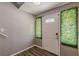 Bright entryway with white door and faux greenery at 217 Maple Nw St, Atlanta, GA 30314
