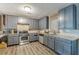 Modern kitchen with gray cabinets, granite counters, and stainless steel appliances at 217 Maple Nw St, Atlanta, GA 30314