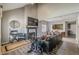 Open living room featuring a sectional sofa, fireplace, and views to dining area at 217 Maple Nw St, Atlanta, GA 30314