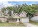 Tan two-story house with a garage and porch at 217 Maple Nw St, Atlanta, GA 30314
