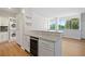 Updated kitchen features granite countertops, stainless steel appliances, and in-unit laundry at 3060 Pharr Court North Nw # 317, Atlanta, GA 30305