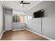 Bedroom with wood-look floors, ceiling fan, and city views at 3060 Pharr Court North Nw # 317, Atlanta, GA 30305