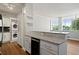 Updated kitchen features granite countertops, stainless steel appliances, and in-unit laundry at 3060 Pharr Court North Nw # 317, Atlanta, GA 30305