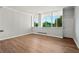 Spacious living room with hardwood floors and large windows at 3060 Pharr Court North Nw # 317, Atlanta, GA 30305