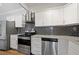 Modern kitchen with stainless steel appliances and granite countertops at 3060 Pharr Court North Nw # 317, Atlanta, GA 30305