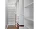 Spacious walk-in closet with custom built-in shelving at 3060 Pharr Court North Nw # 317, Atlanta, GA 30305