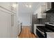 Modern kitchen with white cabinets, granite countertops and stainless steel appliances at 3060 Pharr Court North Nw # 317, Atlanta, GA 30305
