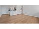 Open concept kitchen and living area with stainless steel appliances and wood-look flooring at 3060 Pharr Court North Nw # 317, Atlanta, GA 30305