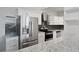 Modern kitchen with stainless steel appliances and granite countertops at 3060 Pharr Court North Nw # 317, Atlanta, GA 30305