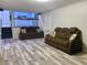 Finished basement with two reclining sofas and kitchen view at 4132 Scenic Mountain Dr, Snellville, GA 30039