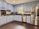 Updated kitchen with stainless steel appliances and light blue cabinets at 4132 Scenic Mountain Dr, Snellville, GA 30039