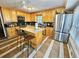 Spacious kitchen with island, stainless steel appliances, and light wood cabinets at 2598 Canon Sw Dr, Marietta, GA 30064