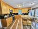 Kitchen features an island, stainless steel appliances, and light wood cabinets at 2598 Canon Sw Dr, Marietta, GA 30064