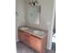 Double vanity bathroom with large mirror and tile floor at 15 Lumby Ln, Covington, GA 30016