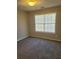 Bright bedroom with neutral walls and carpet at 15 Lumby Ln, Covington, GA 30016