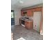 Kitchen with light oak cabinets and tile flooring at 15 Lumby Ln, Covington, GA 30016