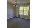 Dining room with chandelier and large window at 15 Lumby Ln, Covington, GA 30016