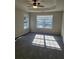 Main bedroom with ceiling fan and large window at 15 Lumby Ln, Covington, GA 30016