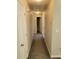 Hallway with carpet and access to bedrooms and bath at 15 Lumby Ln, Covington, GA 30016