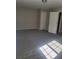 Bright bedroom with grey carpet and double doors at 15 Lumby Ln, Covington, GA 30016