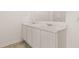 Double vanity with marble countertop in a bright bathroom at 8590 Seabiscuit Rd, Lithonia, GA 30058