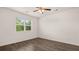 Bright bedroom with hardwood floors and ceiling fan at 8590 Seabiscuit Rd, Lithonia, GA 30058