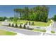 New homes community entrance with lush landscaping and signage at 8588 Preakness Pass, Lithonia, GA 30058