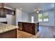 Modern kitchen with granite island and stainless appliances at 6198 Ripple Way # 87, South Fulton, GA 30349