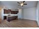 Spacious living area with hardwood floors and kitchen island view at 6198 Ripple Way # 87, South Fulton, GA 30349