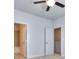 Bright bedroom with carpet flooring, an attached bathroom, and a walk-in closet at 6198 Ripple Way # 87, South Fulton, GA 30349