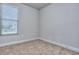 Spacious bedroom with carpeted floor and window with blinds at 6198 Ripple Way # 87, South Fulton, GA 30349