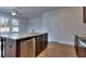 Kitchen island with granite countertop and stainless steel dishwasher at 6198 Ripple Way # 87, South Fulton, GA 30349