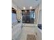 Modern bathroom featuring a walk-in shower with herringbone tile and a soaking tub at 727 Cascade Sw Ave, Atlanta, GA 30310