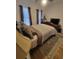 Bright bedroom with king-size bed, hardwood floors, and neutral decor at 727 Cascade Sw Ave, Atlanta, GA 30310
