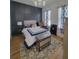 Serene bedroom with a queen bed and an accent wall at 727 Cascade Sw Ave, Atlanta, GA 30310