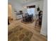 Bright dining room features hardwood floors, a round table with four chairs, and decorative rug at 727 Cascade Sw Ave, Atlanta, GA 30310
