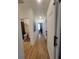 Light-filled hallway with hardwood floors and access to multiple rooms at 727 Cascade Sw Ave, Atlanta, GA 30310