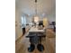 Kitchen island with gray cabinets, white countertops, and two black barstools at 727 Cascade Sw Ave, Atlanta, GA 30310