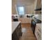 Well-equipped kitchen with white cabinets and a gas range at 727 Cascade Sw Ave, Atlanta, GA 30310