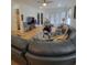 Spacious living room featuring a large sectional sofa and hardwood floors at 727 Cascade Sw Ave, Atlanta, GA 30310