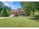 Two-story house with a spacious lawn and mature trees at 52 Olivia Ct, Palmetto, GA 30268