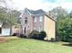 Two story home with manicured lawn and landscaping at 221 Larkshyre Trl, Lawrenceville, GA 30043