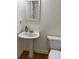 Charming bathroom with pedestal sink and toilet at 221 Larkshyre Trl, Lawrenceville, GA 30043