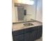 Bathroom features a dark vanity with granite countertop and a large mirror at 221 Larkshyre Trl, Lawrenceville, GA 30043