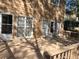 Home's back deck and exterior, showcasing access from multiple doors at 221 Larkshyre Trl, Lawrenceville, GA 30043