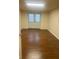 Finished basement room with hardwood floors and french doors at 221 Larkshyre Trl, Lawrenceville, GA 30043