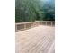Wooden deck with railings, overlooking trees at 221 Larkshyre Trl, Lawrenceville, GA 30043
