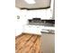 Basement kitchen with white cabinets, granite countertops and tile backsplash at 221 Larkshyre Trl, Lawrenceville, GA 30043